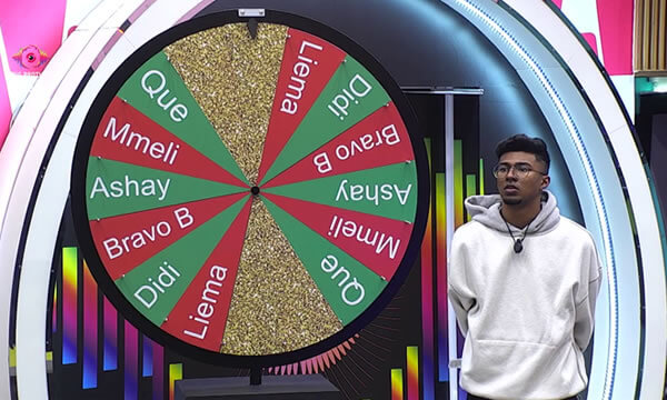 Head of House, Ashay, standing next to the Redemption Wheel during the Big Brother Mzansi Season 6 week 9 nominations
